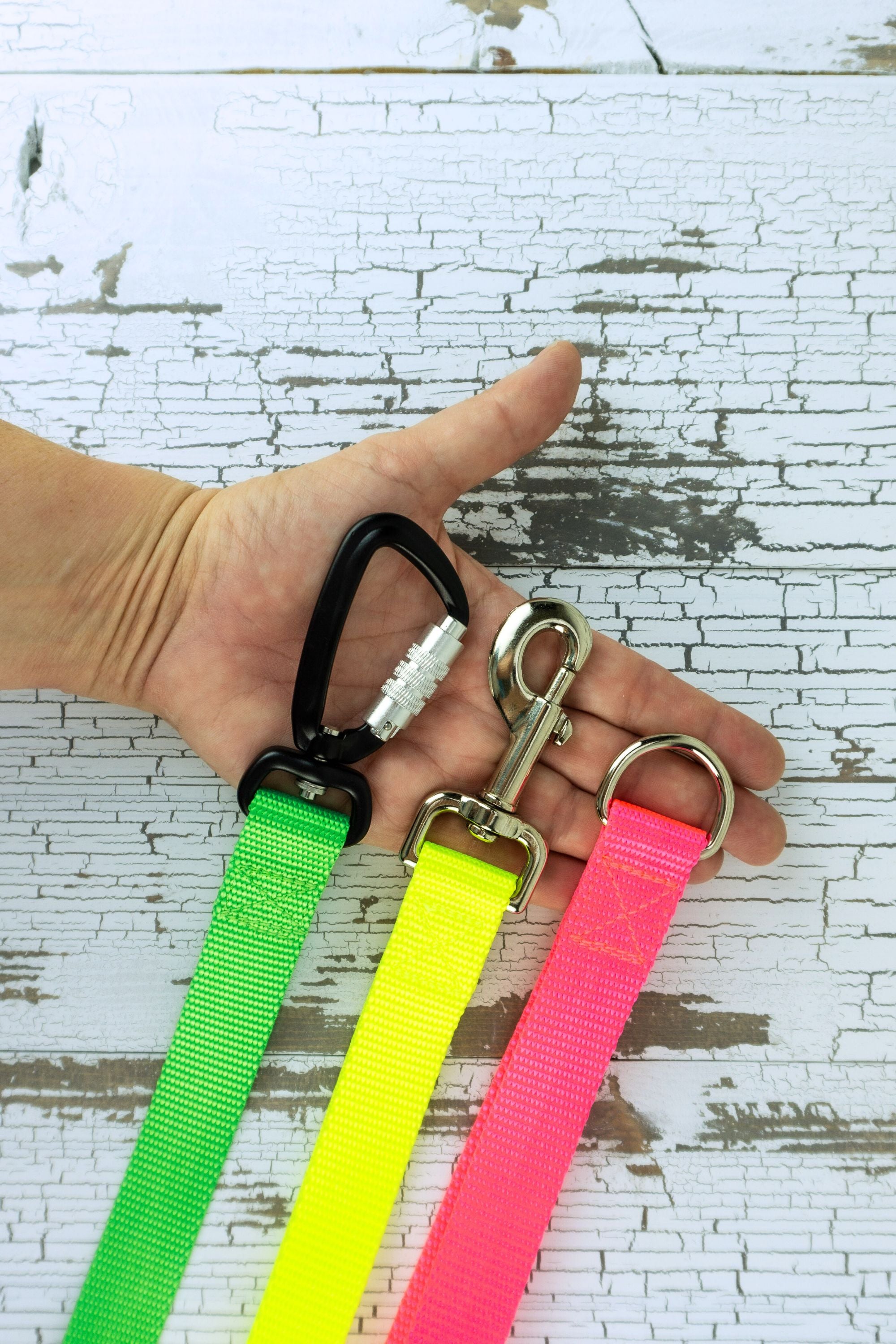 Hardware options available for the leash handles are a an auto locking carabiner, swivel snap bolt, or a heavy duty welded d ring.