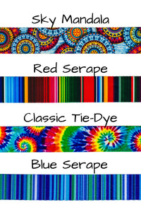 Patterned webbing comes in four fun patterns, including mandala with a combination of dark blue, light blue, red, and a golden yellow. Red serape has multiple striped colors including reds, greens, blues, and oranges. Classic tie die has bright spiral colors of green, light and dark blue, red, orange, and yellow. Blue serape has multiple colors of blue stripes with a bit of green intermixed.