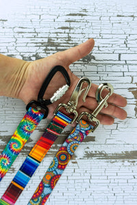 Three hardware options are shown in an adult hand for scale.