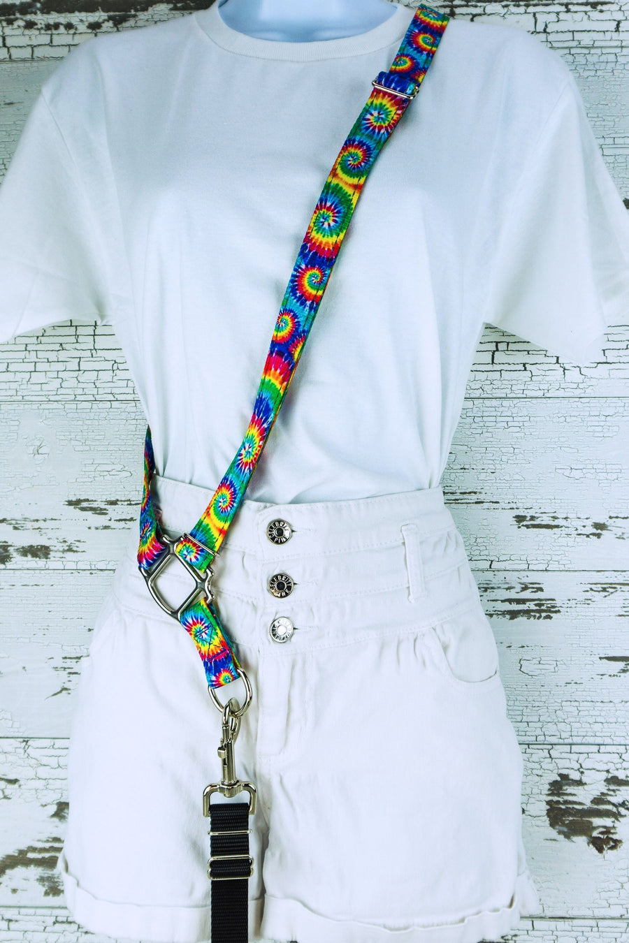Classic tie dye cross body strap shown on mannequin with clip on leash. 