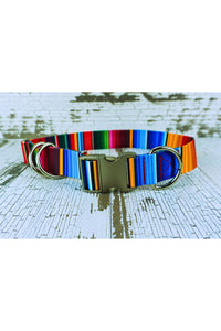 Closeup of the patterned webbing heavy duty hands free leash belt showing the silver aluminum buckle, the heavy duty d ring fixed next to the buckle, and the two heavy duty floating d rings. The belt also includes a triglide slide and keeper for easy adjustability.