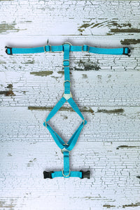 light blue y front dog harness laid flat.