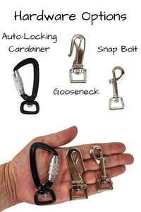 three options are available for the dog end of the leash, the auto locking carabiner, gooseneck clip and swivel snap bolt are shown for scale in the palm of an adult hand. 