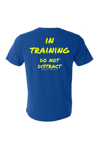 Blue t-shirt with yellow text 'IN TRAINING DO NOT DISTRACT' on the shirt back.