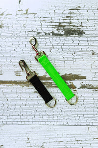 heavy duty training tabs are shown in a flat lay in the colors black and neon green.