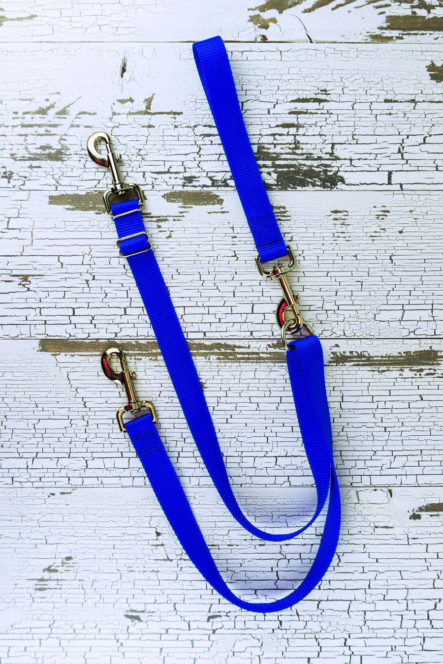 No pull adjustable leash in blue shown in flat lay with leash handle attached to floating d ring. Hardware selection is swivel snap bolts.