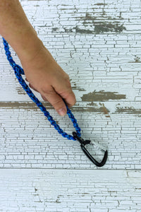 A closeup of the loop end of the braided paracord leash with a standard weight swivel snap bolt.