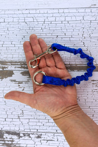 closeup of bungee leash add on hardware including a swivel snap bolt and a three quarters inch heavy duty welded o ring.