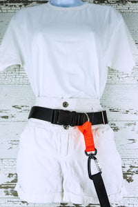 The belt add-on loop handle leash clip is shown connected to the fixed d ring on a hands free dog leash belt that is displayed on a mannequin.