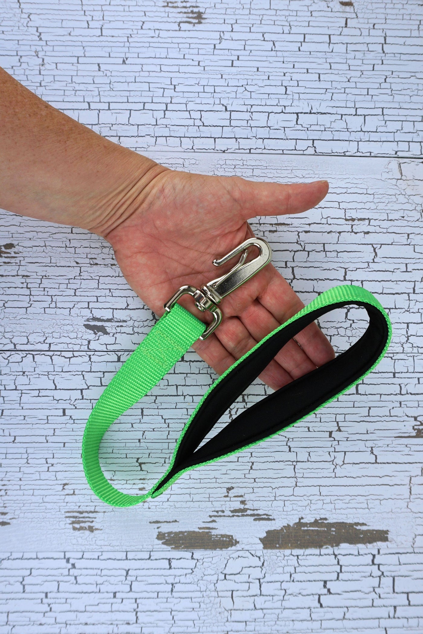 short neon green loop handle leash with gooseneck clip and black neoprene padded leash handle.