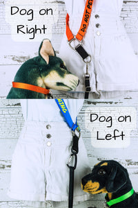 Closeups show the dog on the right configuration and the dog on left configuration. The webbing shoulder strap meets the square hardware component and extending off of that is a short piece of webbing with either a d ring or a carabiner. This short webbing and hardware should point forward from the side of the person, allowing the dog to walk at heel with a relaxed lead on the preferred side of the body.