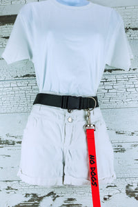 The hands free leash with no dogs on red is shown connected to a hands free leash belt on a mannequin.