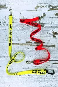 These hands free leashes with safety messages are shown here in a 6 foot length, including the we need space message on yellow with the auto locking carabiner hardware selection, and the no dogs on red message with the snap bolt hardware option.