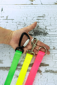 Hardware options available for the leash handles are a an auto locking carabiner, swivel snap bolt, or a heavy duty welded d ring.