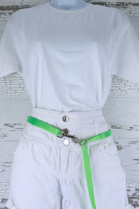 Three way adjustable and convertible leash for small dogs is shown in the waist belt configuration, made in a neon green webbing.