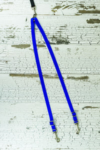 Light weight leash coupler for small dogs shown in blue.