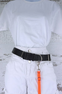 Neon adjustable length hands free leashes for small dogs shown here in a neon orange, clipped onto a dog leash waist belt.