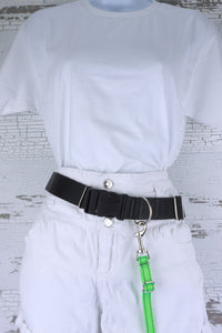 Reflective adjustable length hands free leash for small dog shown in a reflective neon green webbing clipped to a leash belt.
