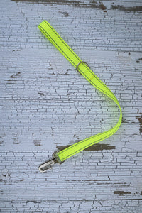 two foot long leash in reflective neon yellow with a gooseneck clip.