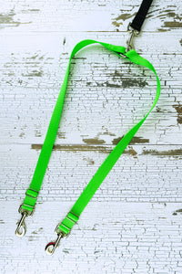 Leash coupler for medium to large dogs shown in a flat lay in the neon green color adjustable option.