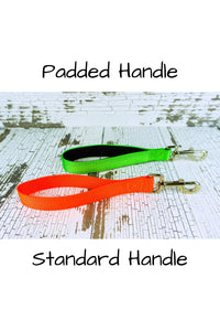 Adjustable no pull leashes are available with either standard handles made from heavy duty nylon webbing, or in a handle that is padded with black neoprene.