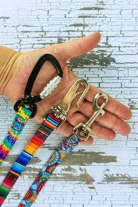 Three hardware options are shown in a closeup in the palm of an adult hand for scale.