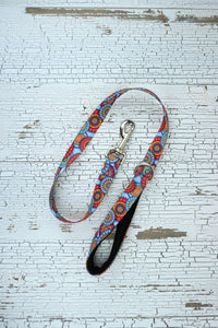 patterned handheld leash in sky mandala with black neonprene padded loop handle.