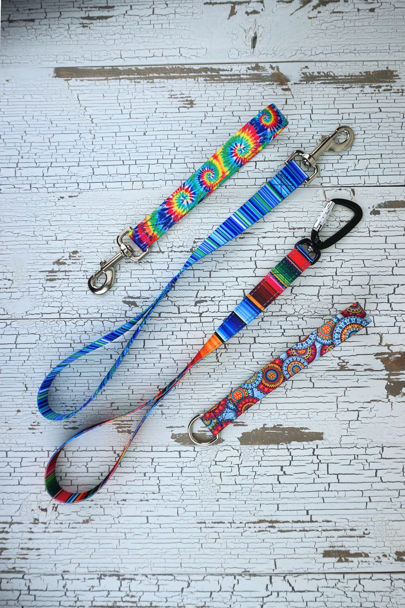 leash handles in two length of sublimated polyester webbing in 4 patterns.