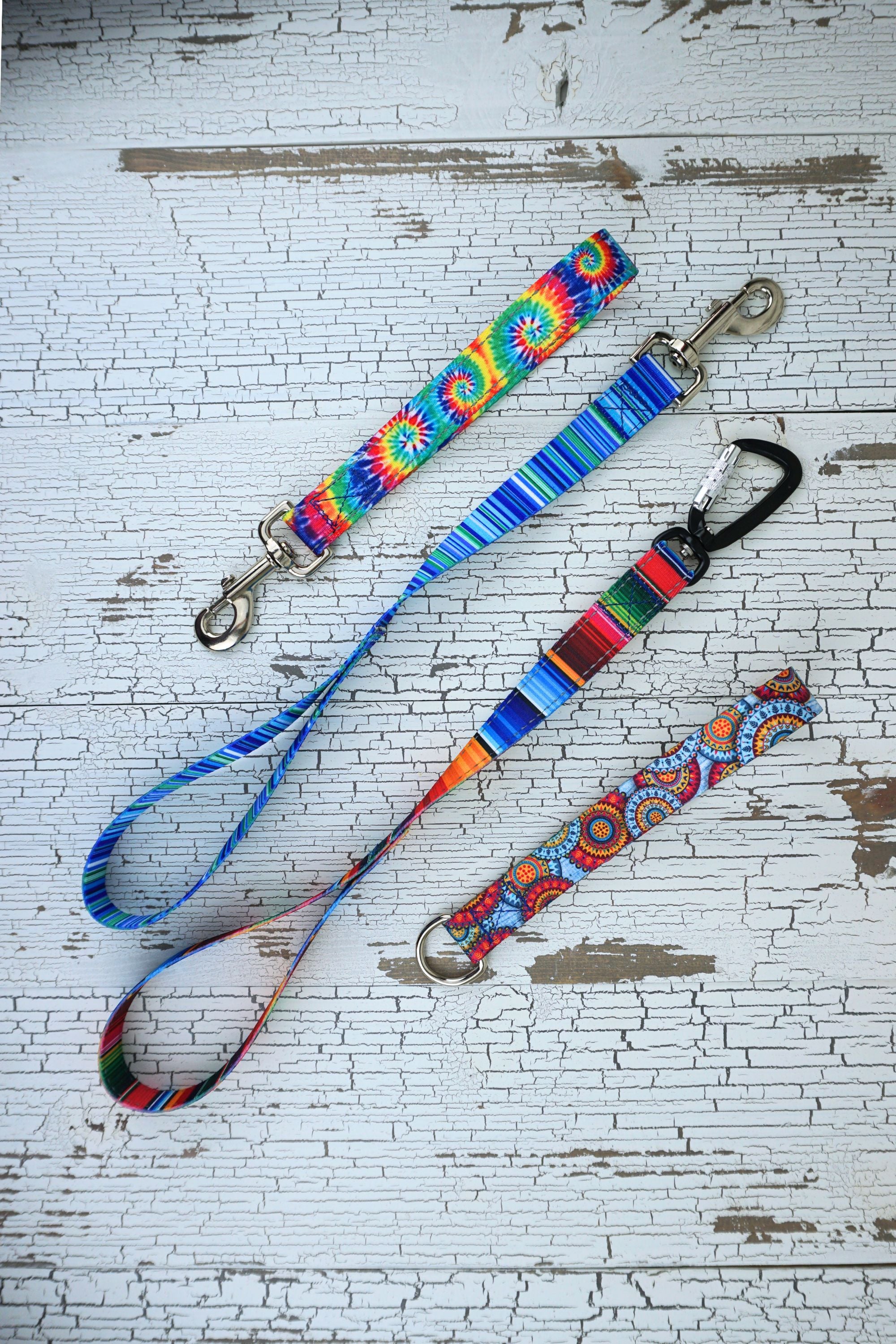 leash handles in two length of sublimated polyester webbing in 4 patterns.