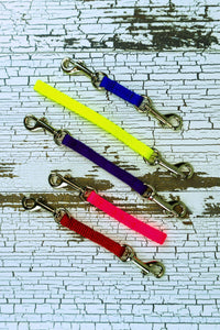 Extra small leash backup straps are shown in a flat lay, highlighting multiple colors, lengths, and clip configurations.